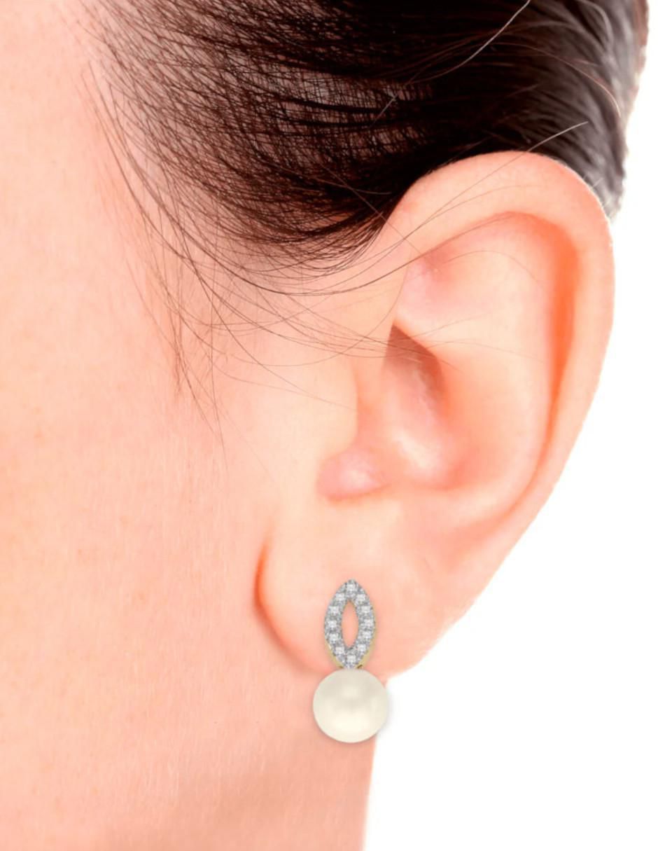 Aretes ovalados Teles de oro con acabado brillante perla y diamante 2