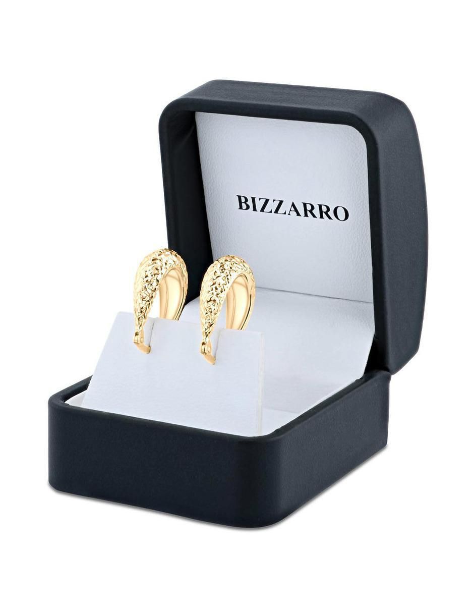 Arracadas ovaladas de oro amarillo 14 k con acabado brillante 4